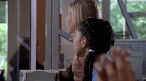 Two Women Sitting in Front of Computer