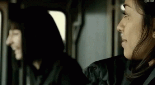 Two Women Sitting Next To Each Other In Car GIF