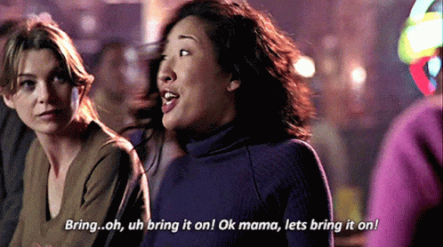 Two Women Sitting Next to Each Other One Saying Bring On