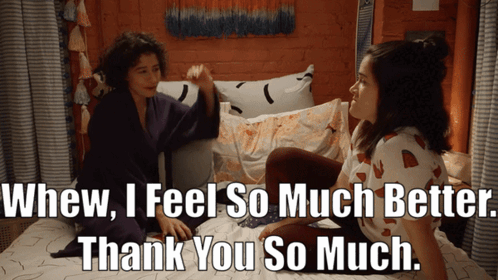 Two Women Sitting On Bed Thanking GIF