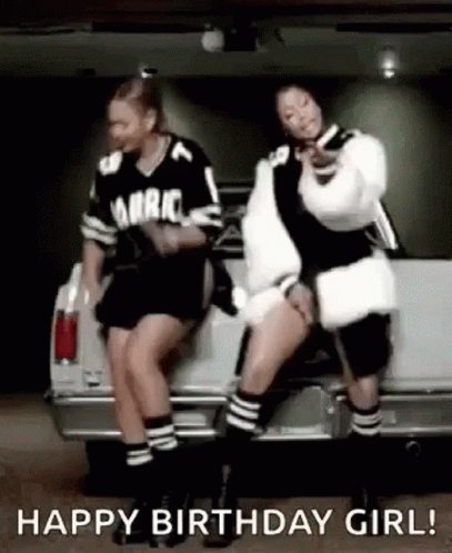 Two Women Sitting on Car Dancing