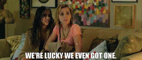 Two Women Sitting on Couch Lucky