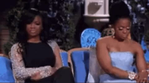 Two Women Sitting On Couch GIF