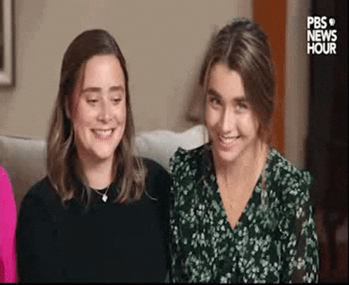 Two Women Sitting on Couch