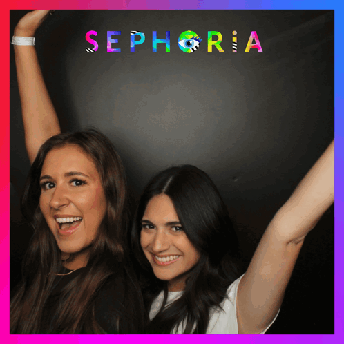 Two Women Standing In Front Of A Sign That Says Sephora GIF