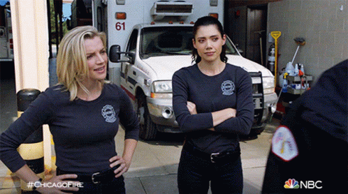 Two Women Standing In Front Of Ambulance 61 GIF
