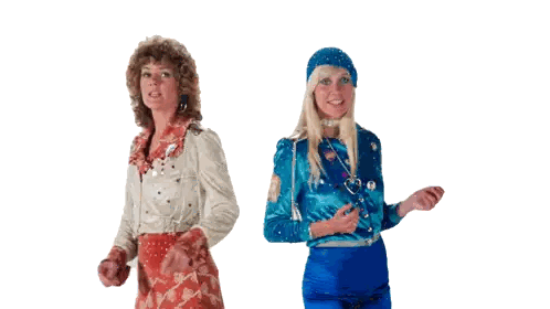 Two Women Standing Next to Each Other