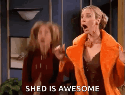 Two Women Standing Next To Each Other One In Orange Coat GIF
