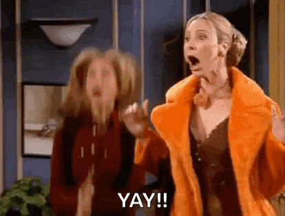 Two Women Standing Next To Each Other GIF