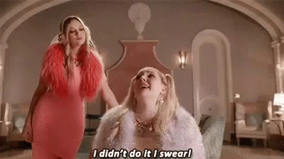 Two Women Standing Next To Each Other GIF