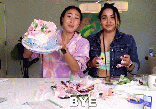 two women standing next to each other with one holding a cake and the other holding a piece of cake with the word bye ab