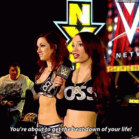 Two Women Standing Next To Each Other With One Saying You 'Re About To Get The Beat Down Of Your Life .. GIF