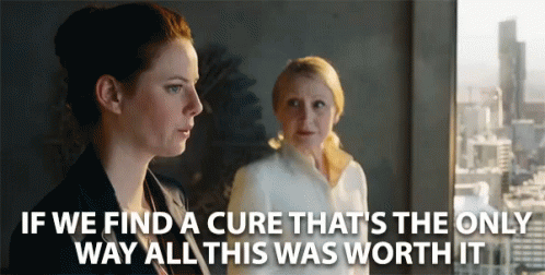 Two Women Standing Next To Each Other With The Words If We Find A Cure GIF