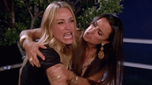 Two Women Standing One Making Funny Face GIF