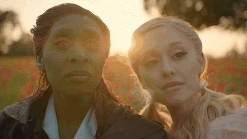 Two Women Standing Together in Sunlight