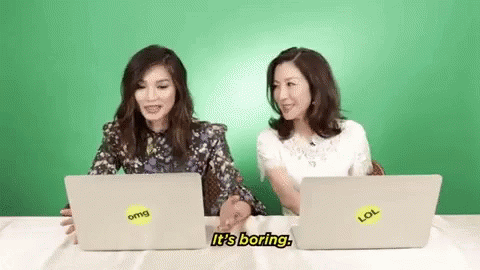 Two Women Talking at Laptops