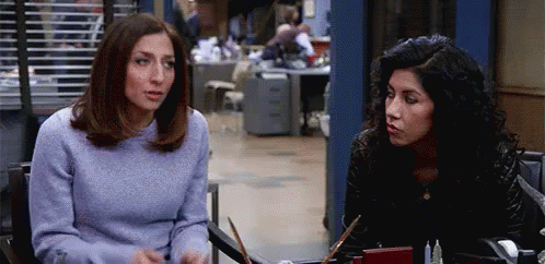 Two Women Talking at Table