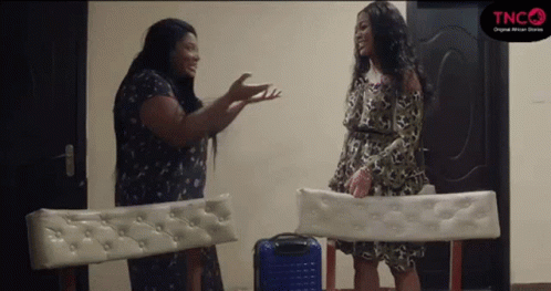 Two Women Talking In Room GIF
