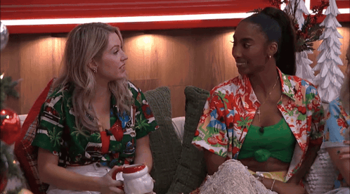 Two Women Talking On Couch GIF