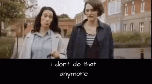 Two Women Talking Park Bench, One With Wig