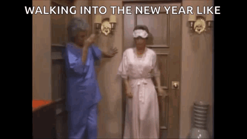 Two Women Walking Into New Year Wearing Sleep Masks