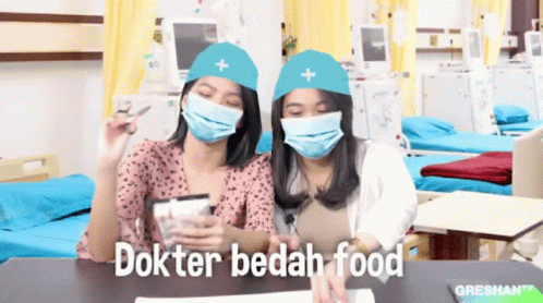Two Women Wearing Masks and Hats