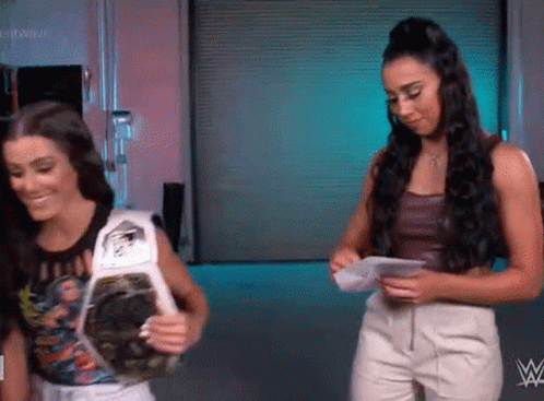 Two Women With Championship Belt