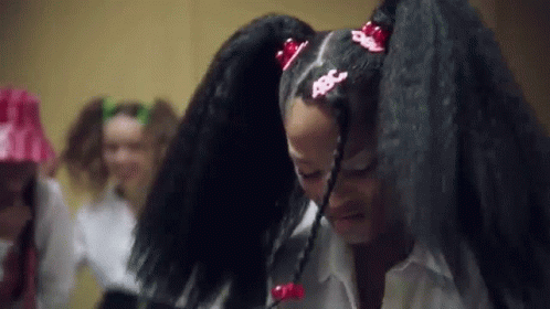Two Women with Long Black Hair, One Ponytailed