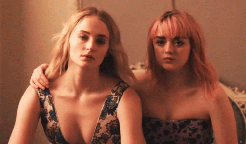 Two Women With Pink Hair Are Posing For A Picture GIF
