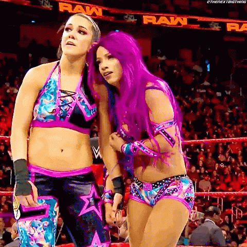 Two Women With Purple Hair Standing in Ring