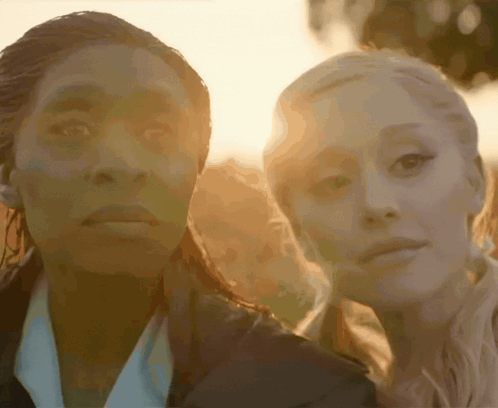 Two Women With Sun Behind Them