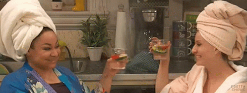 Two Women With Towel Turbans Toasting GIF