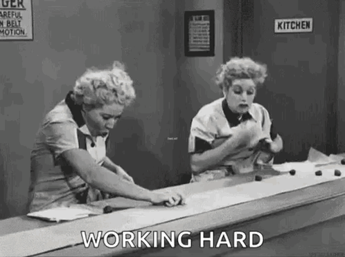 Two Women Working on Conveyor Belt