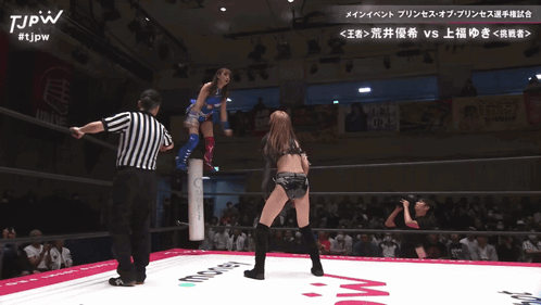 Two Women Wrestling In A Ring With Tjpw Written On The Bottom GIF