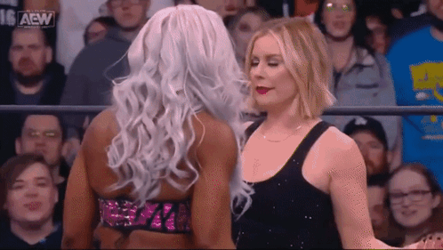 Two Women Wrestling in Front of Crowd
