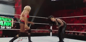 Two Women Wrestling Money in the Bank Sign