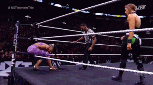 Two Women Wrestling With Referee In Ring GIF