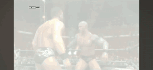 Two Wrestlers Are Fighting In A Ring With The Words Wwe Hd On The Bottom Left GIF
