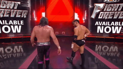 two wrestlers are standing in front of a sign that says fight forev available now
