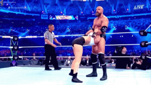 Two Wrestlers Fighting in Ring