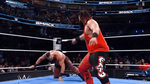 Two Wrestlers In Ring With Smack Down GIF