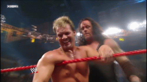 Two Wrestlers in Ring with W Logo
