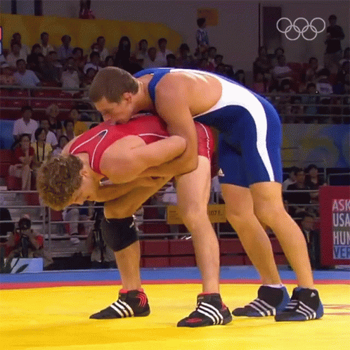 Two Wrestlers on Mat Saying Ask USA Hunt