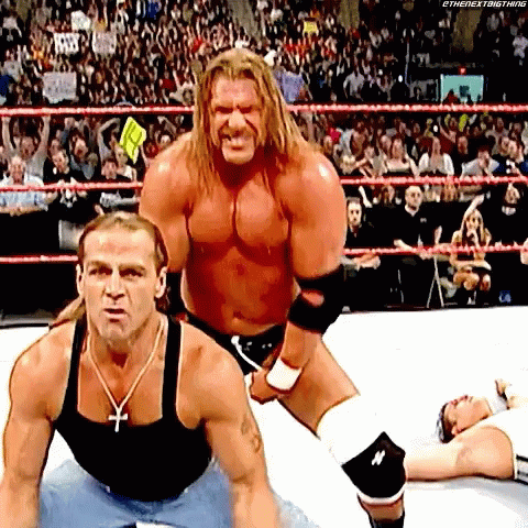 Two Wrestlers One With Cross Necklace