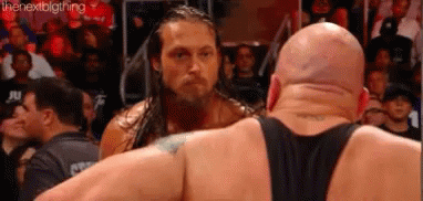Two Wrestlers Side By Side In Wrestling Ring GIF