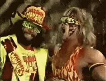 Two Wrestlers Standing Next to Each Other