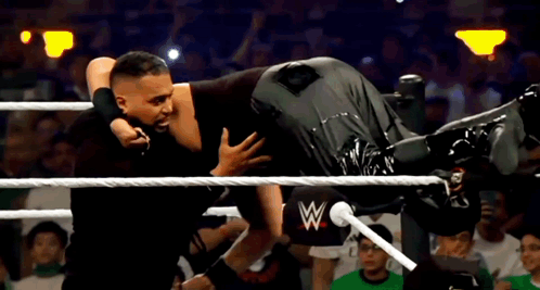 Two Wrestlers Wrestling In Ring GIF