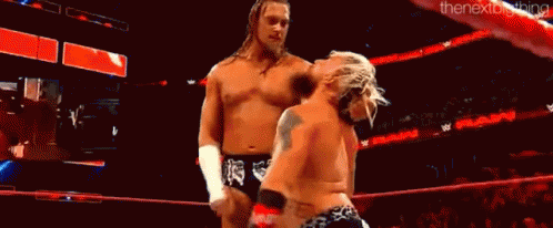 Two Wrestlers Wrestling In Ring With Crowd GIF