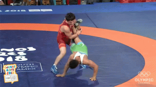 Two Wrestlers Wrestling on Olympic Channel Mat