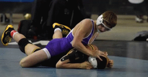 Two Wrestlers Wrestling One Laying on Other's Back
